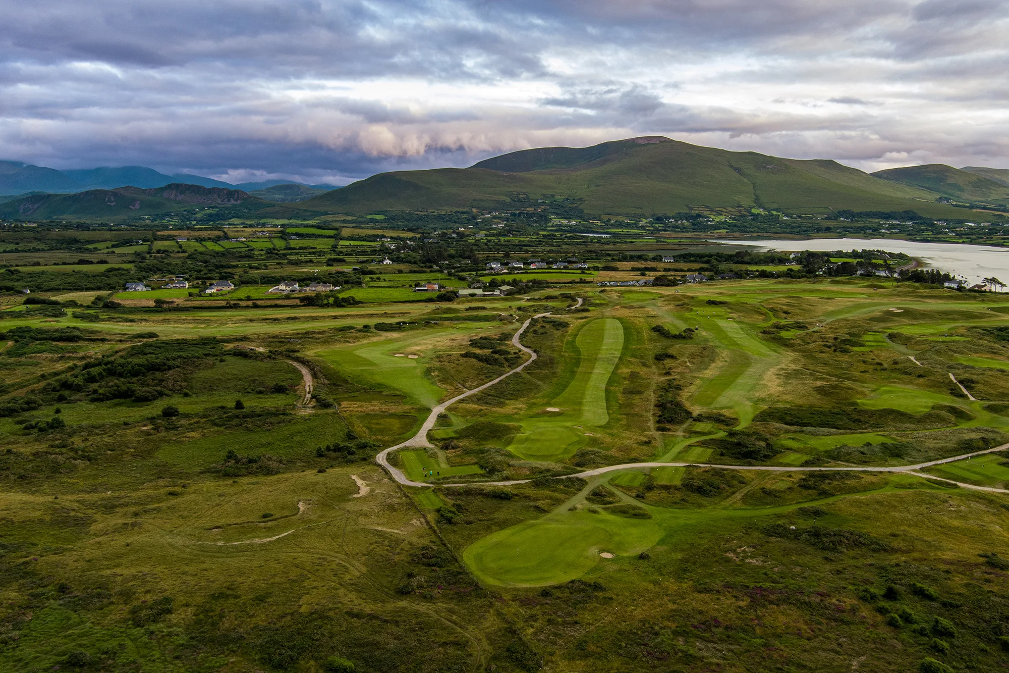 Aerial view of Dooks Golf Club with mountains behind